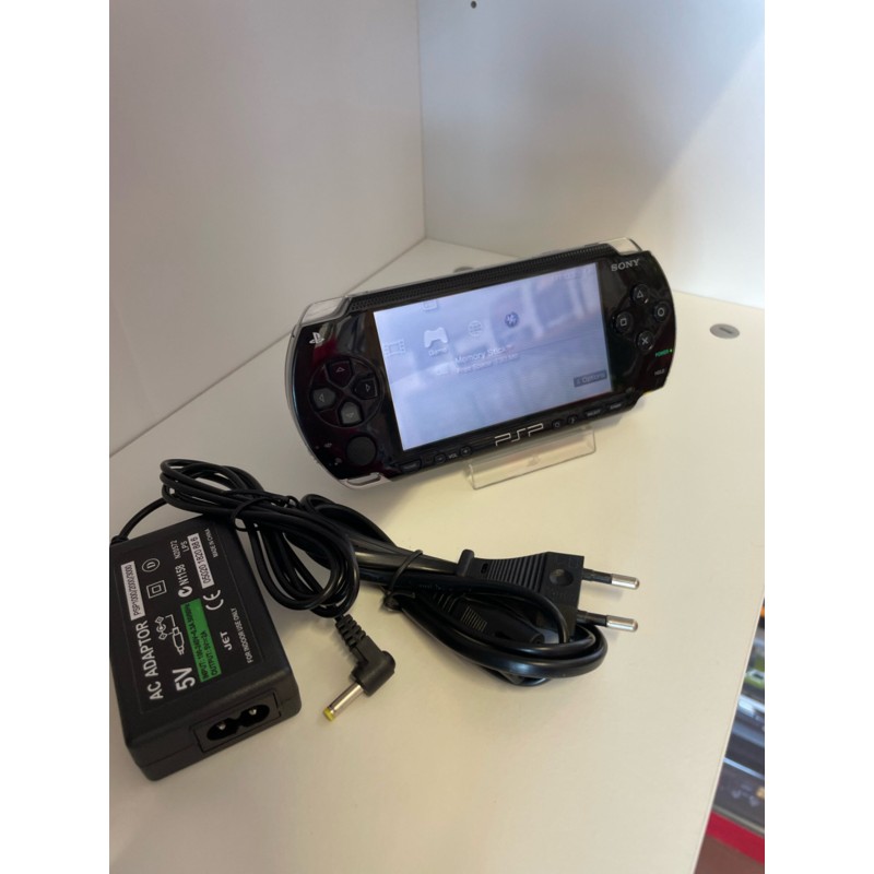 PSP1004 sony playstation portable rankinė konsolė su pakrovėju, atristas, su 10 zaidimu